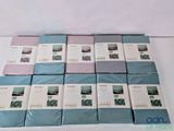 a lot of blue and white sheets stacked on top of each other