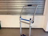 a hand truck that is sitting in a room