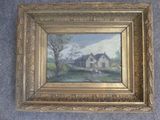 an oil painting of a house in a gold frame on a blue carpet