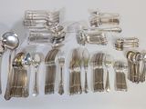 a lot of silver spoons and forks on the table