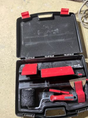 a black case with tools in it sitting on a table