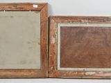 pair of antique wooden picture frames with a mirror in the middle