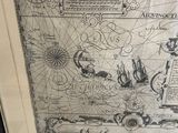 a picture of a map in a frame on a table