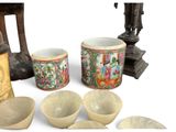 many bowls and cups that are sitting on a table