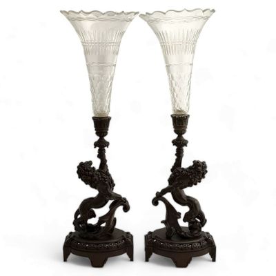 pair of antique glass vases on stand on white background