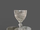 a lot of glass bowls and cups on the table
