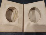 two open books that are sitting on a table