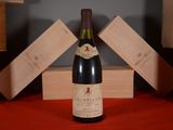a bottle of wine that is sitting on a table