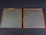 two pieces of chalk on the wall with a rope