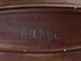 a close up of a brown suitcase with writing on it