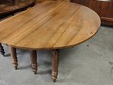 a table that has a wooden top on it in a room