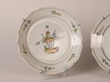 two plates that have flowers on them on them
