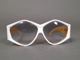 sunglasses on a table with a gray background and a gray background