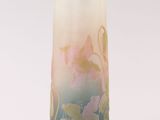 a tall vase with a floral design on it