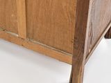 a close up of a bed with a wooden frame