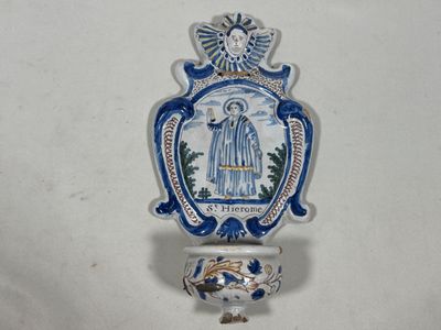a blue and white wall hanging with a picture of a person on it