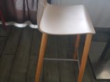 a white chair that is sitting in front of a window