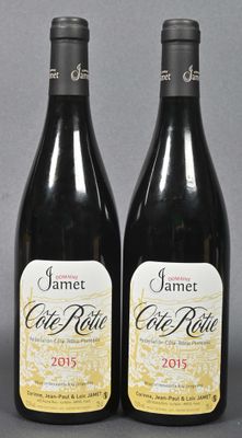 two bottles of wine are sitting next to each other on a table