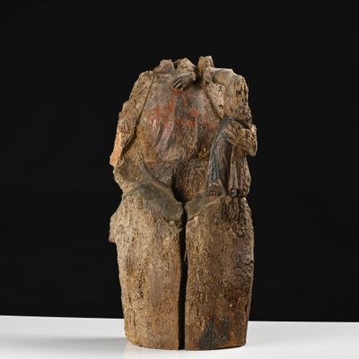 an image of a wooden sculpture of a man and a woman