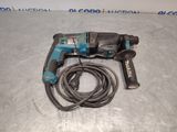 an electric drill with a cord attached to it sitting on a table