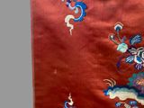a picture of a red cloth with blue and white flowers