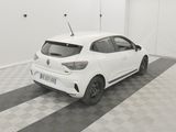 a white car parked in a garage with a checkered floor