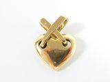 yellow gold heart shaped pin with a cross on it