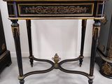 an image of a black and gold table with a clock on top
