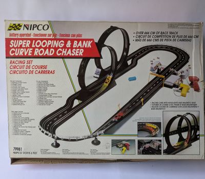 a box that has a model of a car track in it