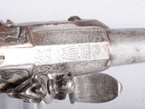 a gun that is on display on a table