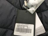 a label on the back of a jacket that is attached to the back of a jacket