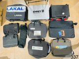 several pieces of luggage are laid out on the floor next to a chair