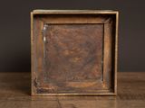 an old wooden picture frame sitting on top of a wooden table
