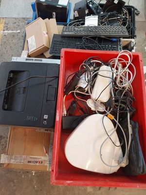 a lot of electronics in a red box on the ground