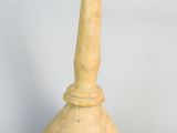a small wooden lamp that is on a white surface