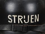 an old black helmet with the word struen written on it