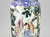 a blue and white vase with a painting on it