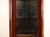 an image of a wooden display cabinet with glass doors