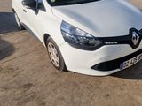 the white car is parked in the parking lot next to other cars