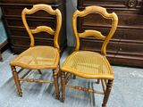 two chairs that are sitting next to each other