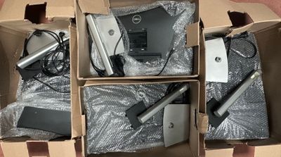three boxes of electronic devices are sitting in a cardboard box