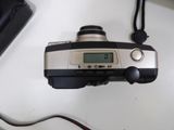 a silver and black digital camera on a white table