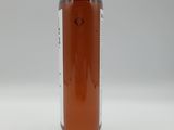 an image of a bottle of liquid sitting on top of a table