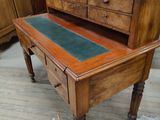 a wooden desk with a mirror on top of it