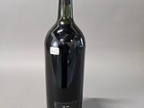 a bottle of wine that is sitting on a table