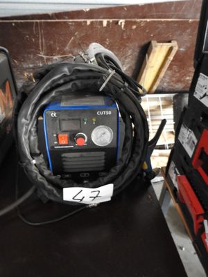 a small air compressor sitting on top of a table