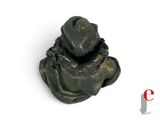 a small statue of a man with a hat on his head