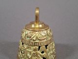 gold plated bell with the word faith on it and a bird on it