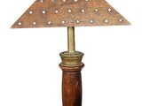 an old fashioned lamp with a wooden base and a metal base
