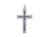 un pendentif en forme de croix, orné de diamants et de saphirs, sur fond blanc
